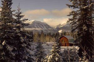 Barn in snow and Rockies